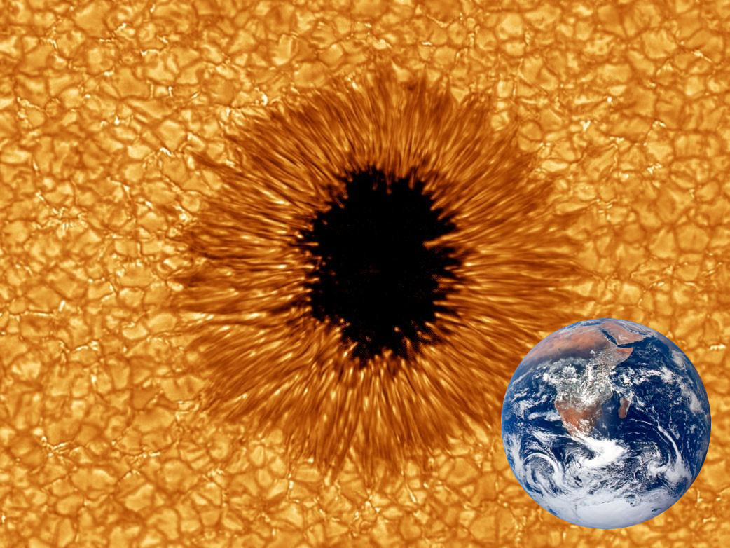A small sunspot is compared in size to the Earth. Clearly visible is how some of the Sun’s convection cells are pushed aside, revealing the cooler photosphere.